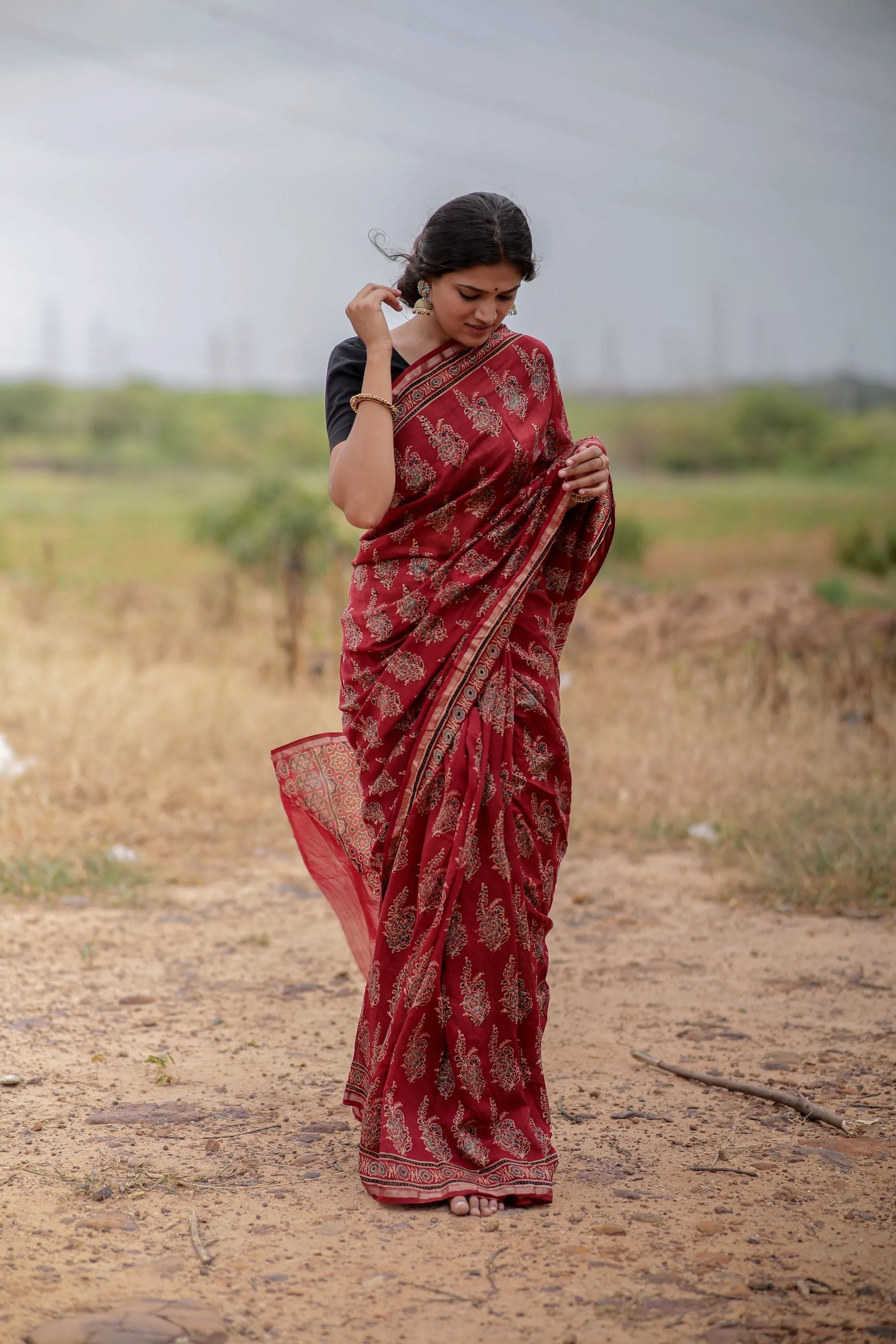 A trsyt with Ajrakh -Jharokha -floral red chanderi ajrakh saree