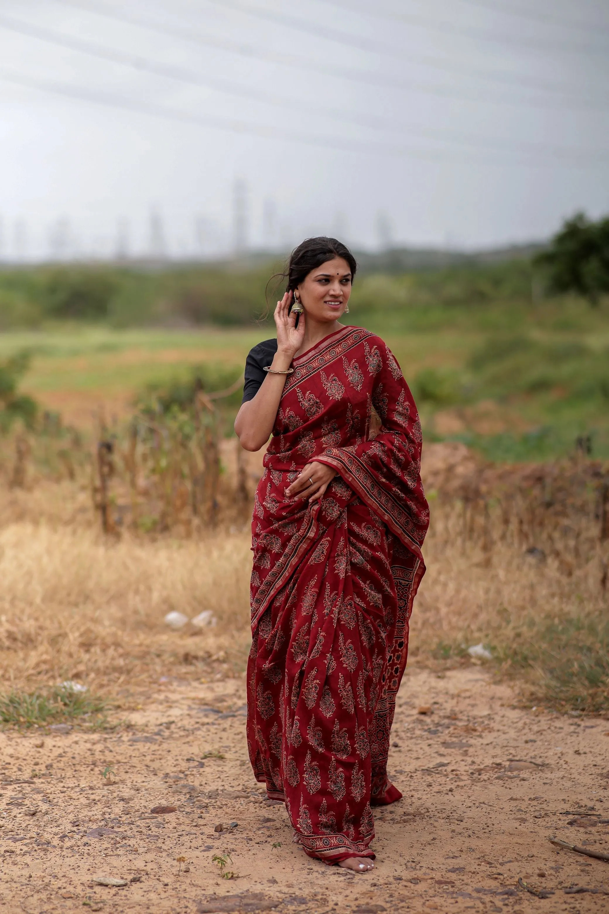 A trsyt with Ajrakh -Jharokha -floral red chanderi ajrakh saree