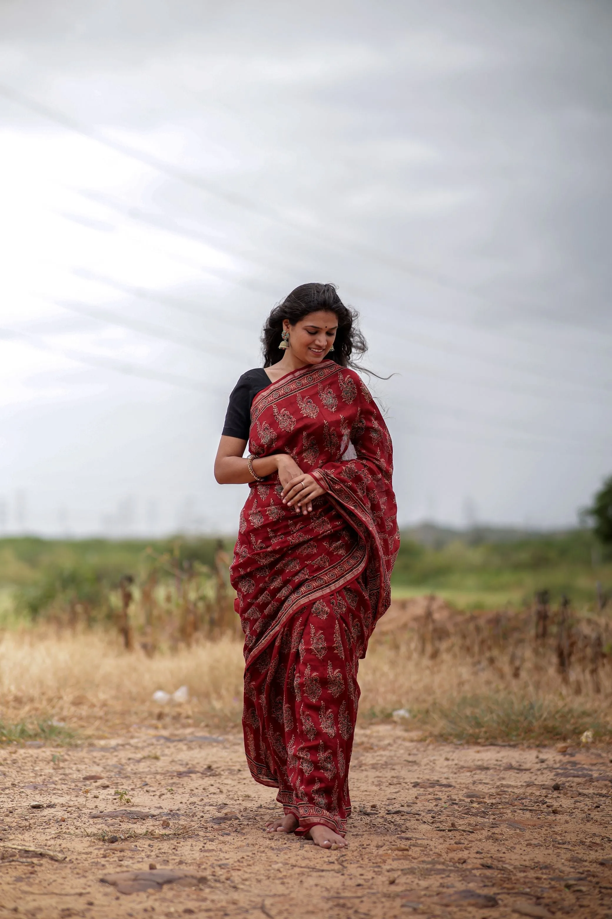 A trsyt with Ajrakh -Jharokha -floral red chanderi ajrakh saree