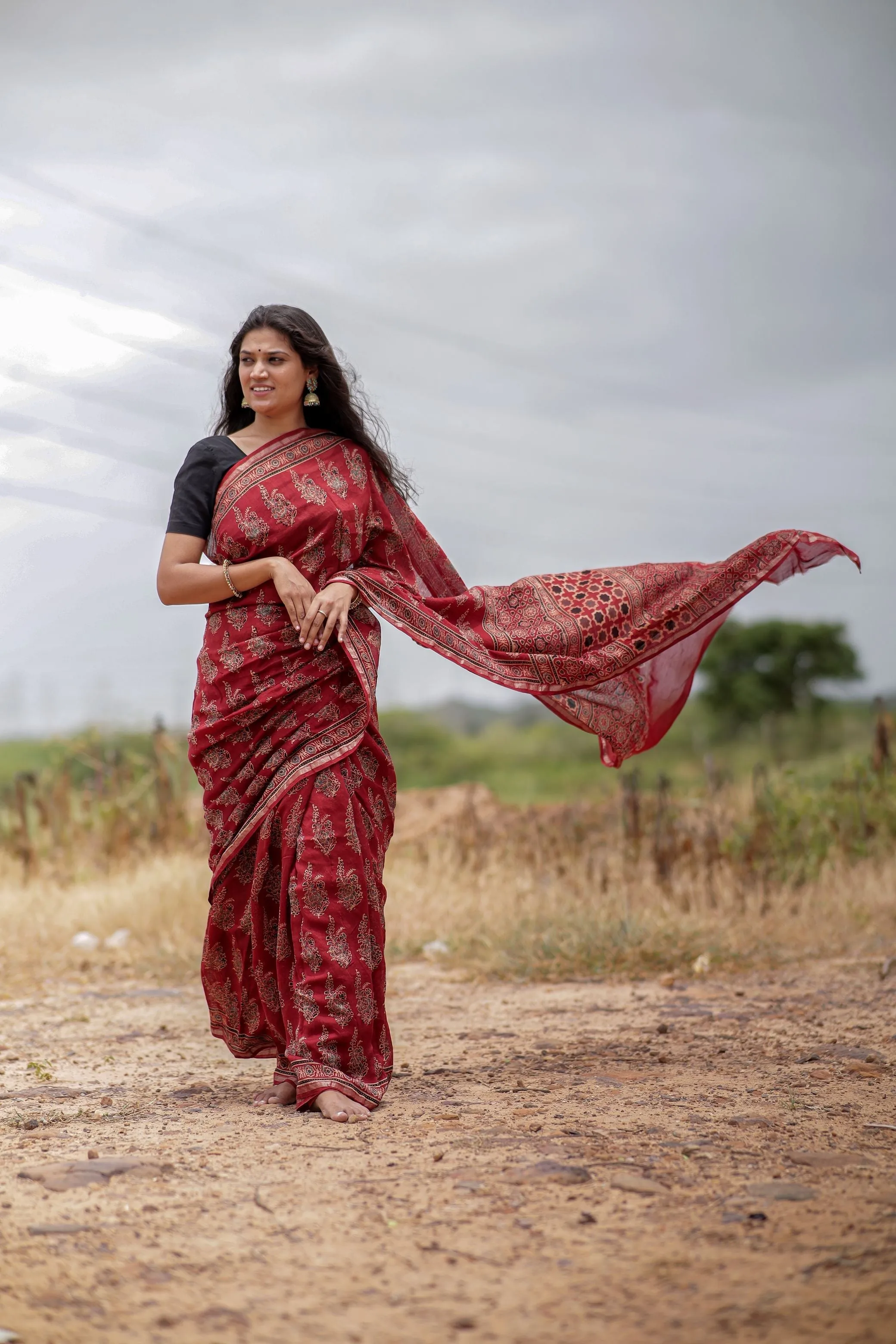 A trsyt with Ajrakh -Jharokha -floral red chanderi ajrakh saree