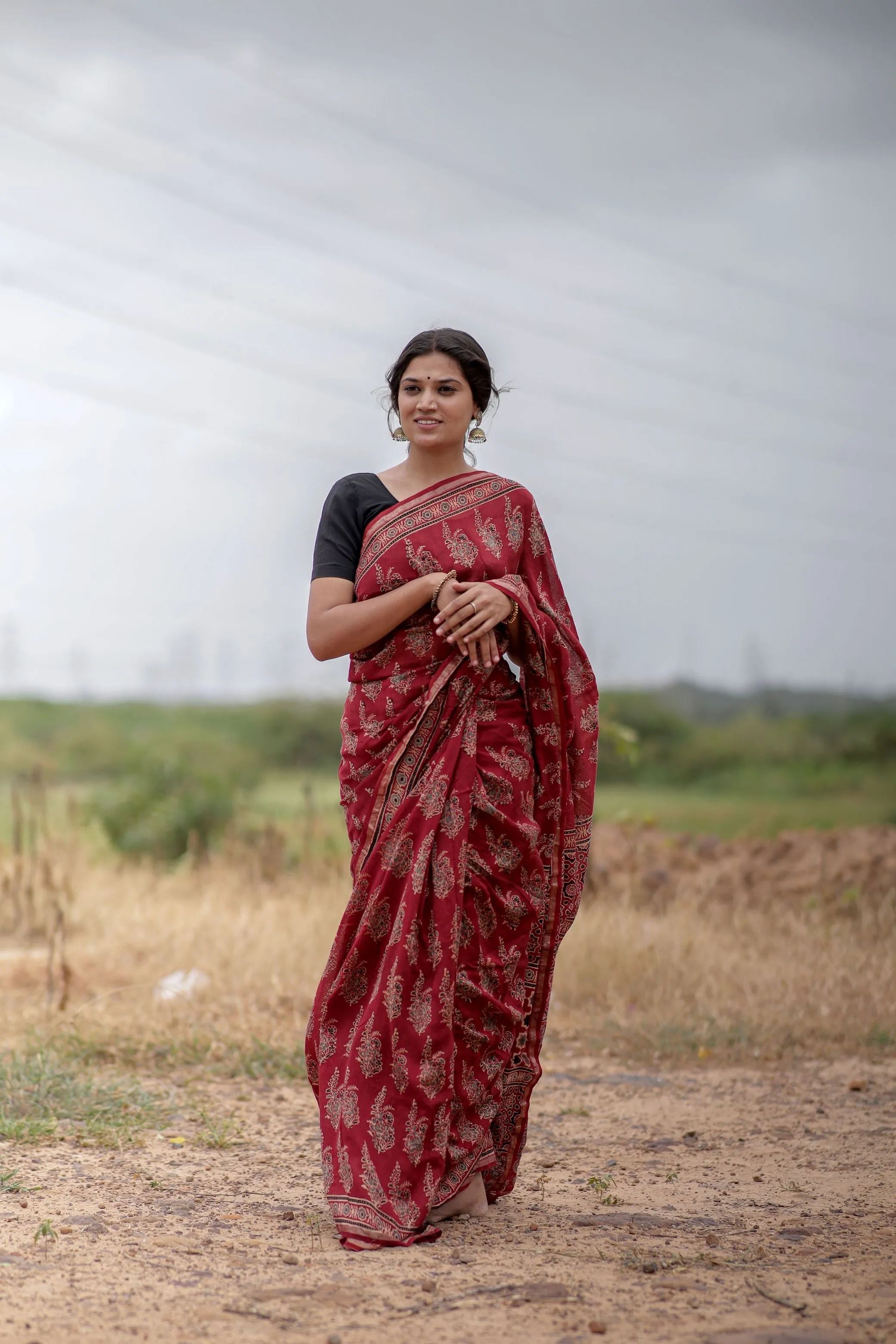 A trsyt with Ajrakh -Jharokha -floral red chanderi ajrakh saree