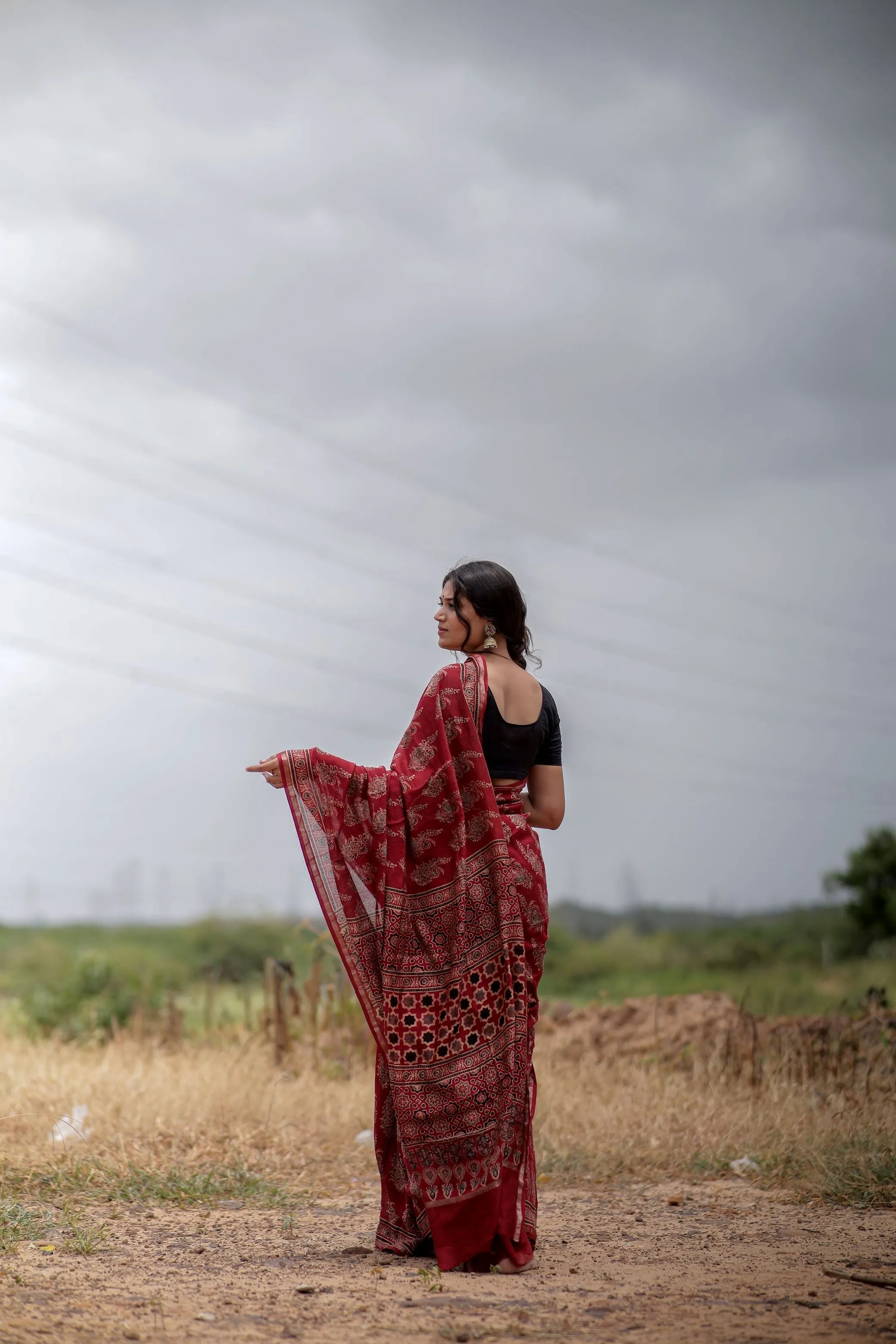 A trsyt with Ajrakh -Jharokha -floral red chanderi ajrakh saree