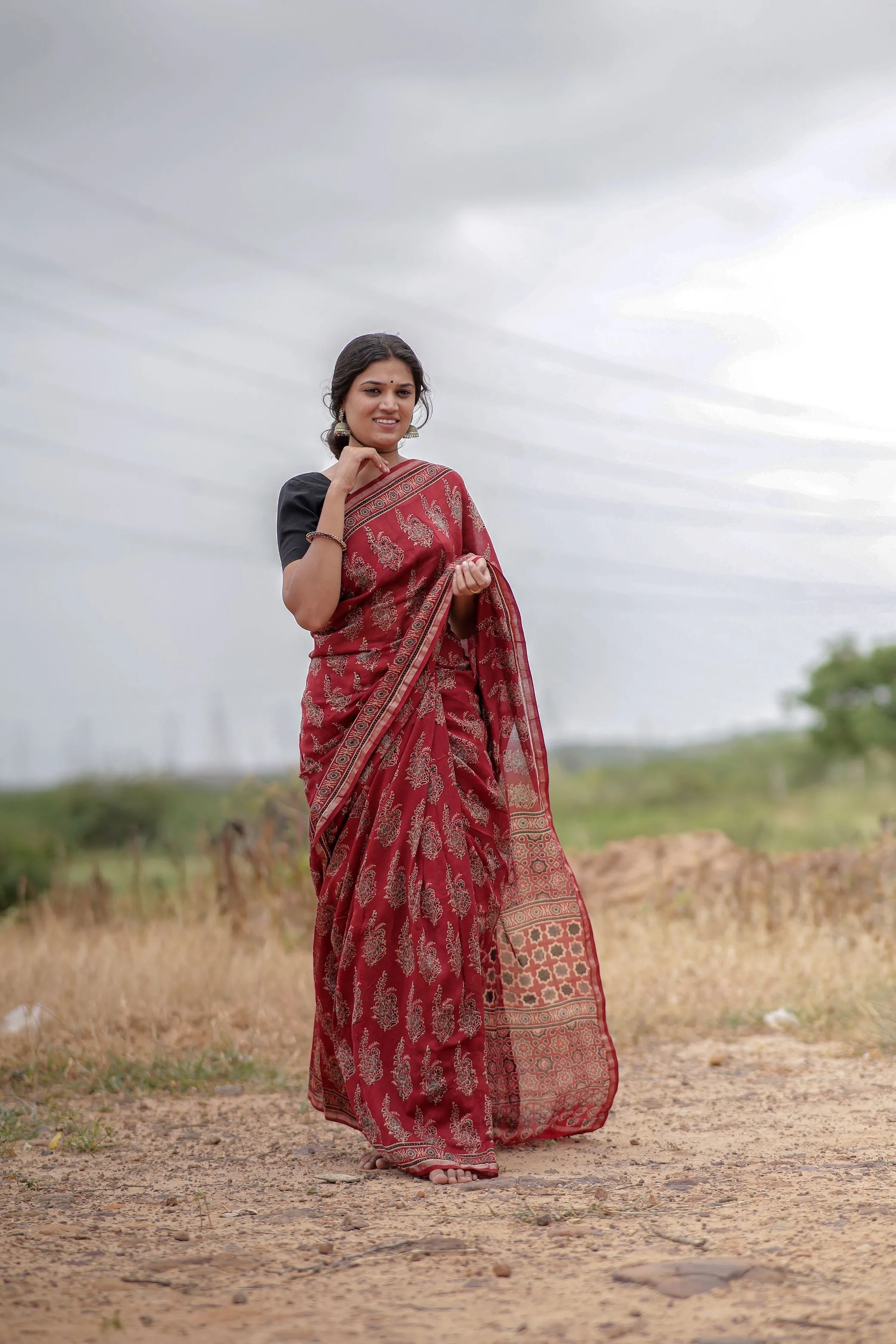 A trsyt with Ajrakh -Jharokha -floral red chanderi ajrakh saree