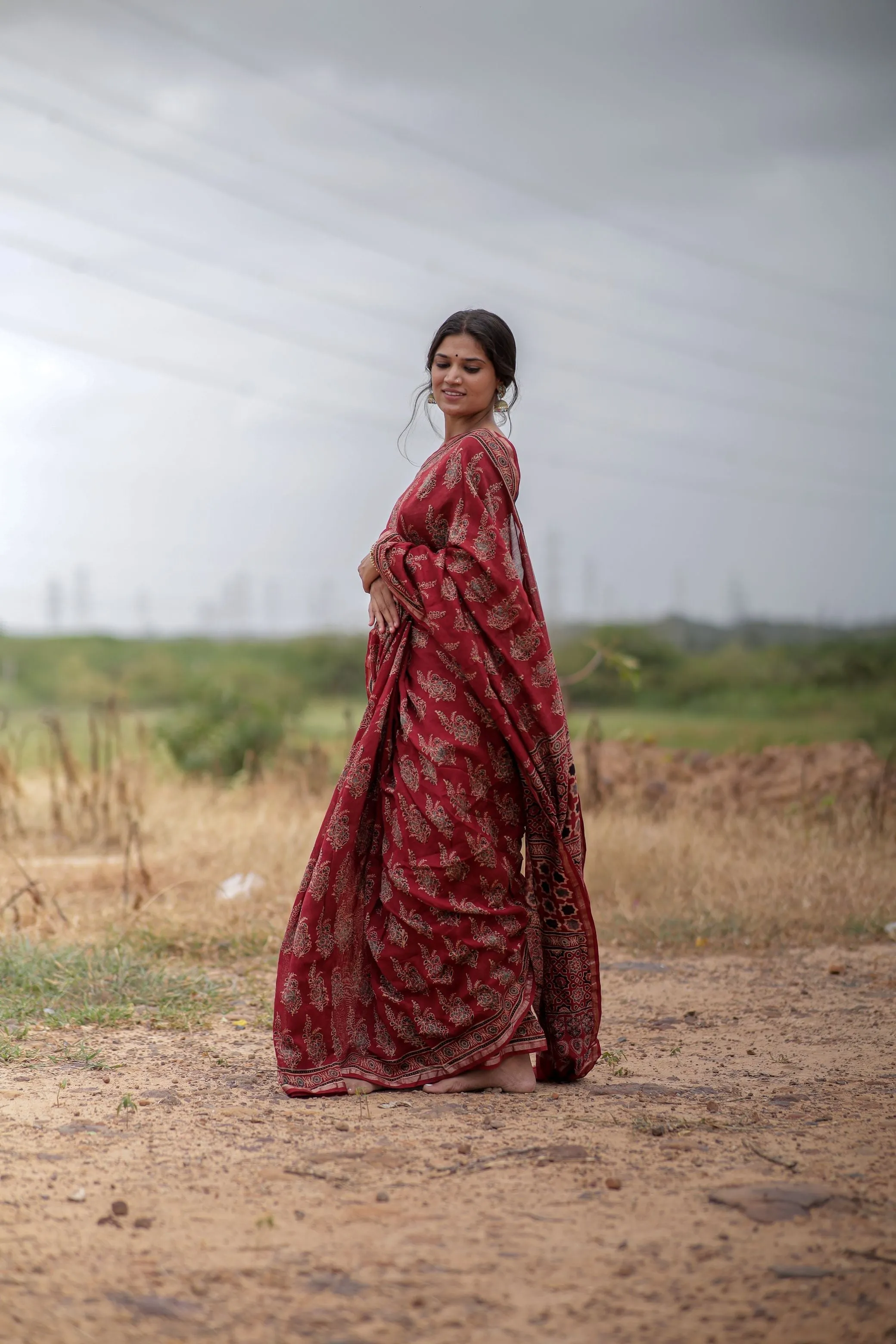 A trsyt with Ajrakh -Jharokha -floral red chanderi ajrakh saree