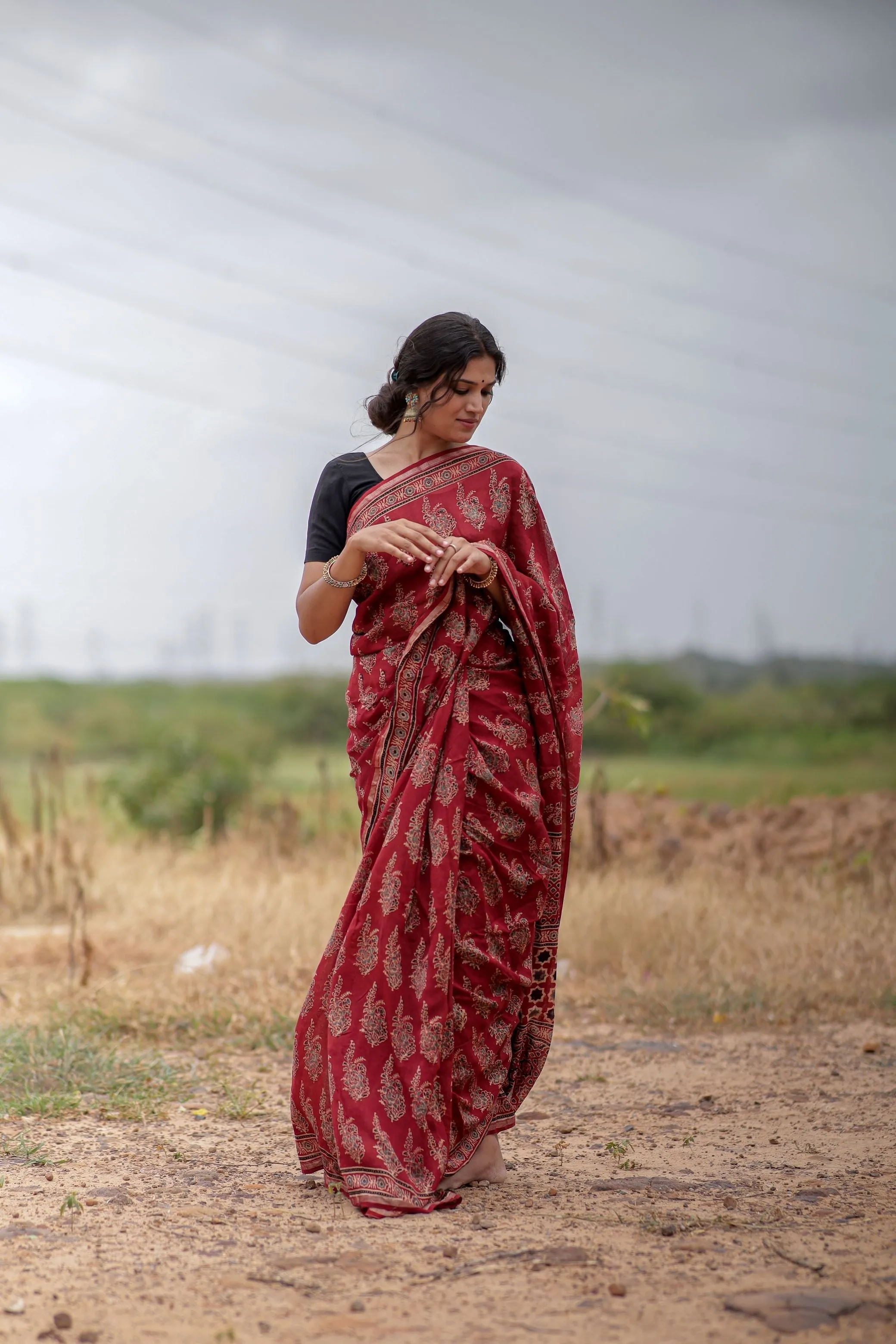 A trsyt with Ajrakh -Jharokha -floral red chanderi ajrakh saree