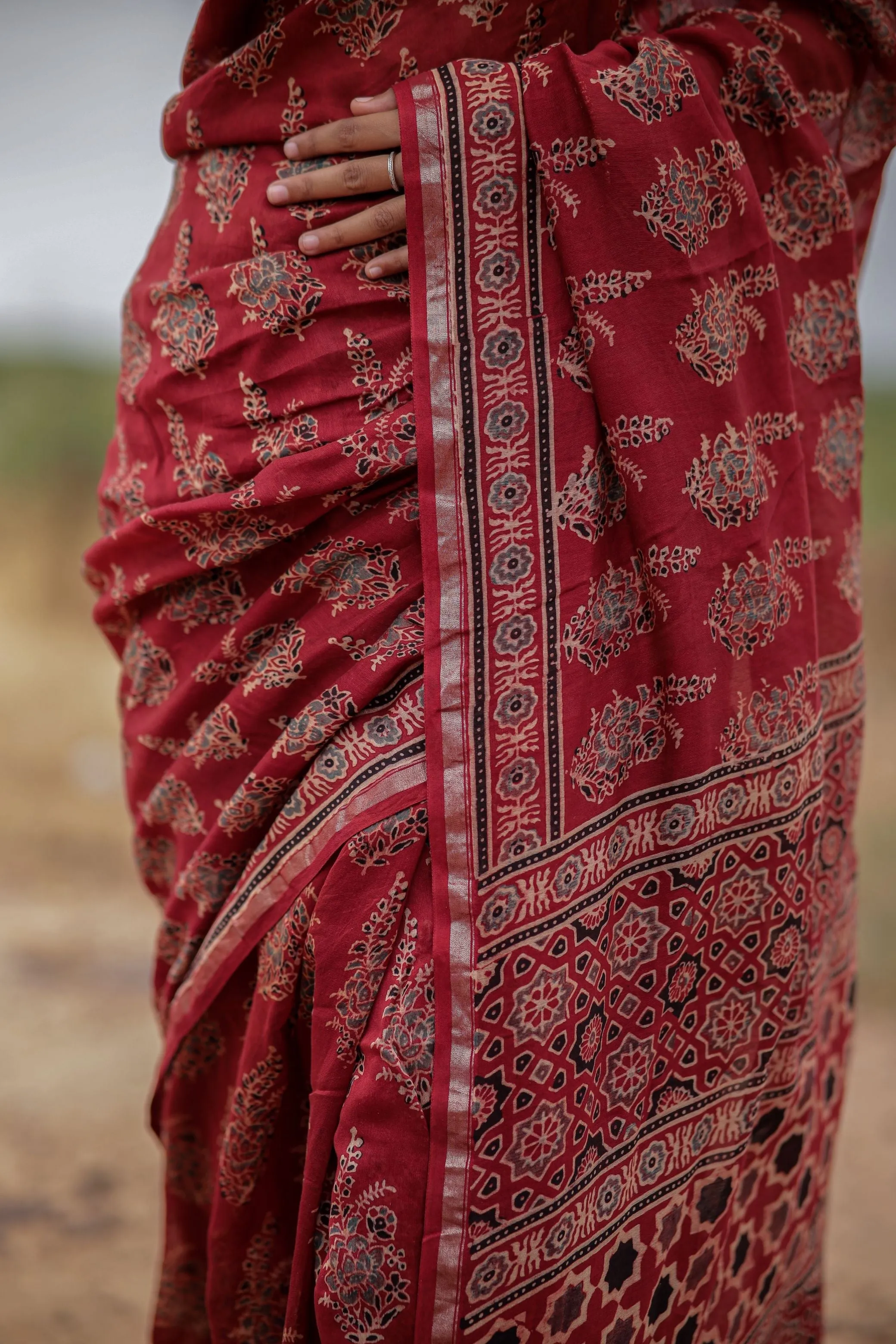 A trsyt with Ajrakh -Jharokha -floral red chanderi ajrakh saree
