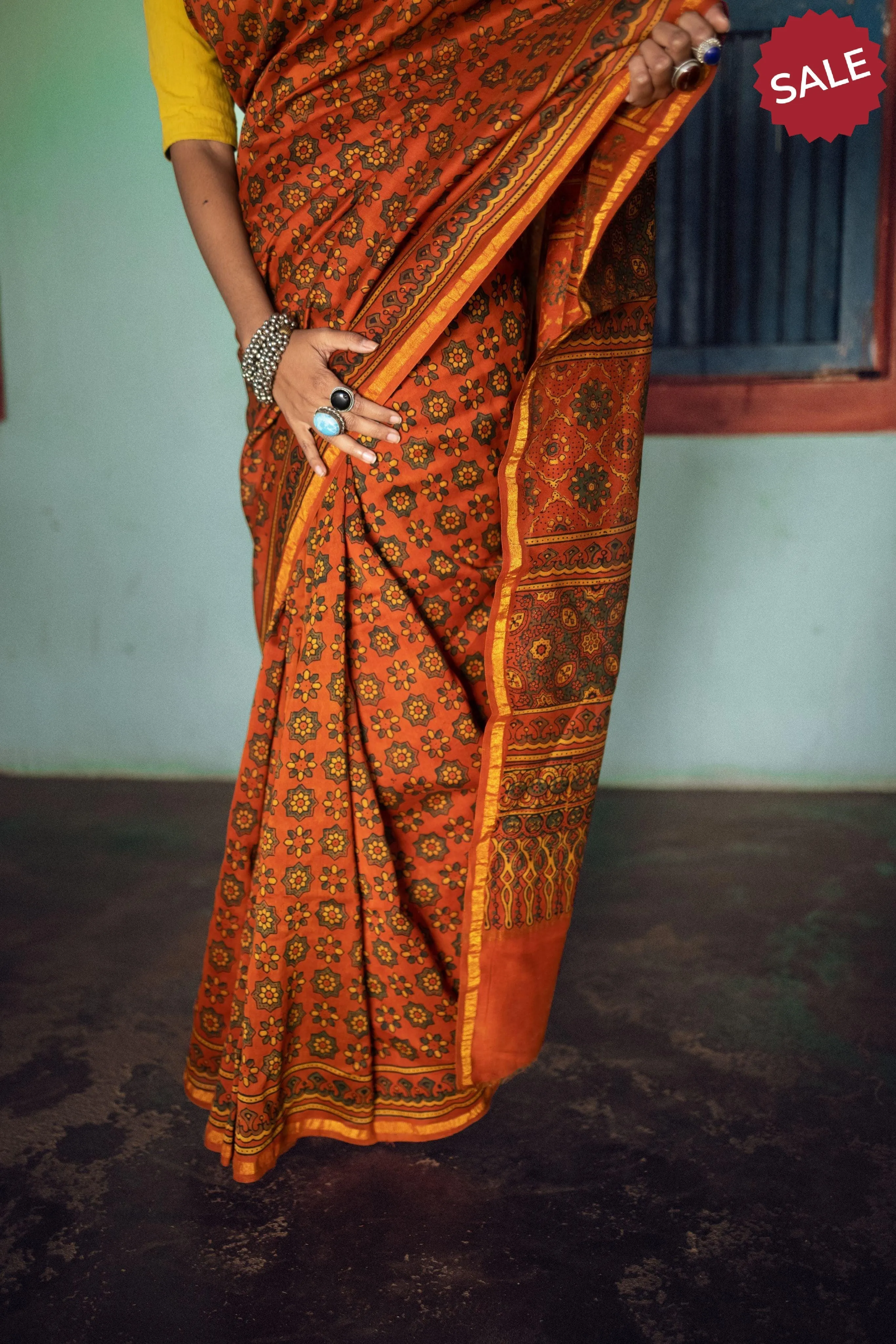 A trsyt with Ajrakh -  Jharokha - Orange green chanderi ajrakh saree