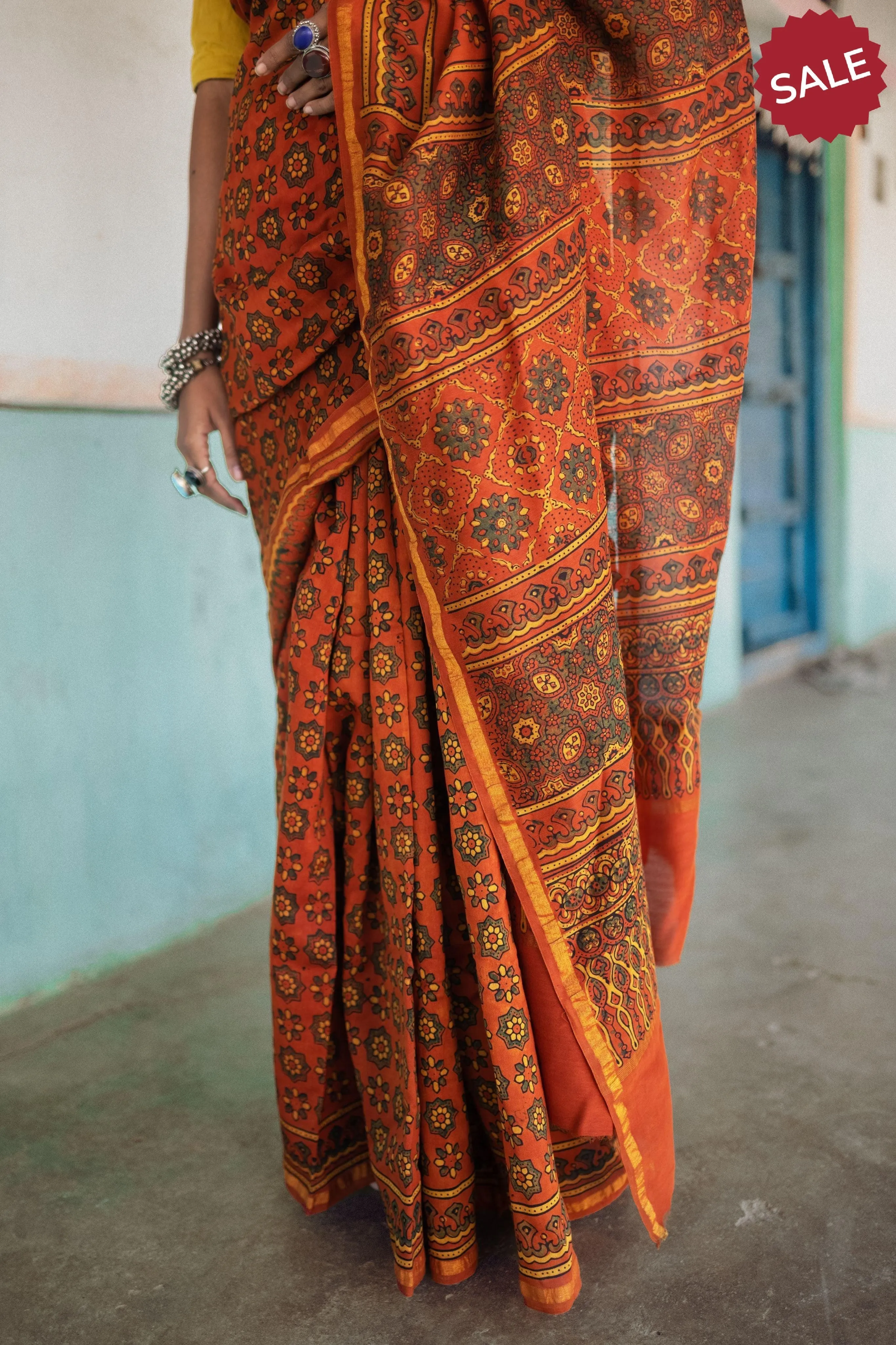 A trsyt with Ajrakh -  Jharokha - Orange green chanderi ajrakh saree